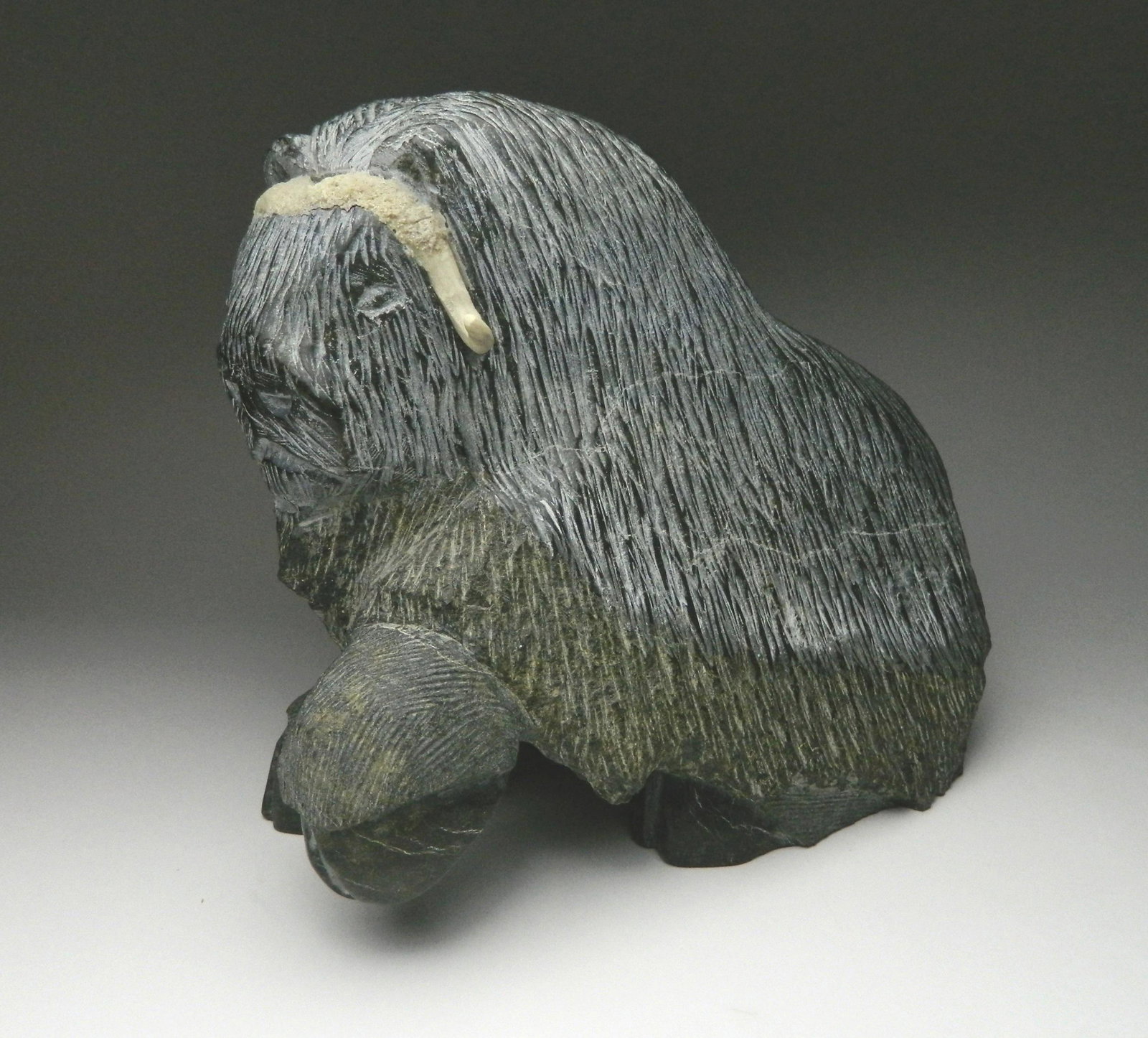Johnnylee Temela stone carving: Johnnylee Temela ''Musk Ox''- stone carving, 2007. 8 1/2 x 10 x 5 1/2'' Provenance: Norman Rusinow collection, Cleveland, OH