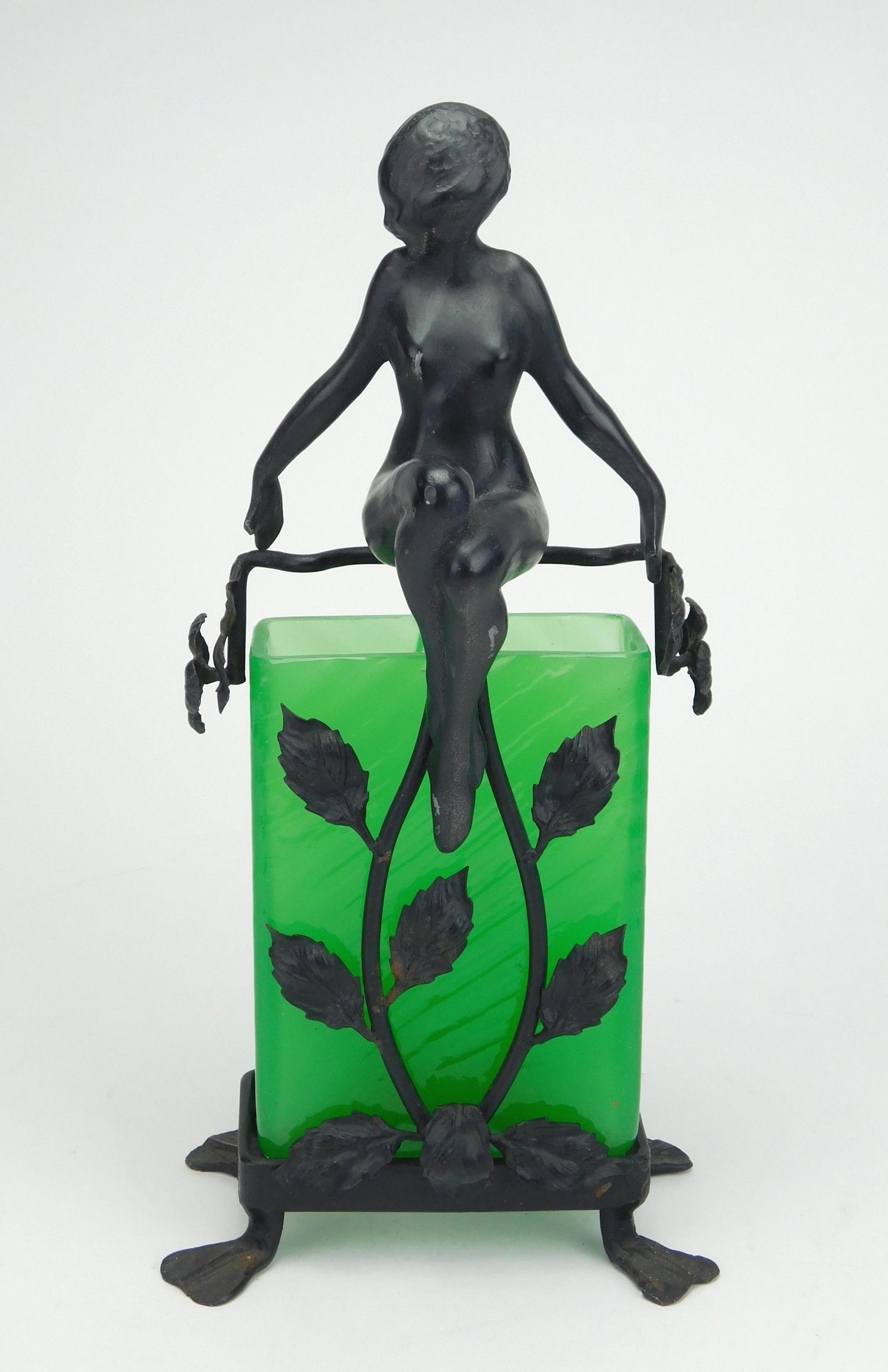 Frankart 'Upright Nude with Vines' vase: Frankart 'Upright Nude with Vines' vase, #F603, with original emerald green Steuben vase that fits into wrought iron base of vines and leaves supporting standing nude, vase has a chip and tight hairli