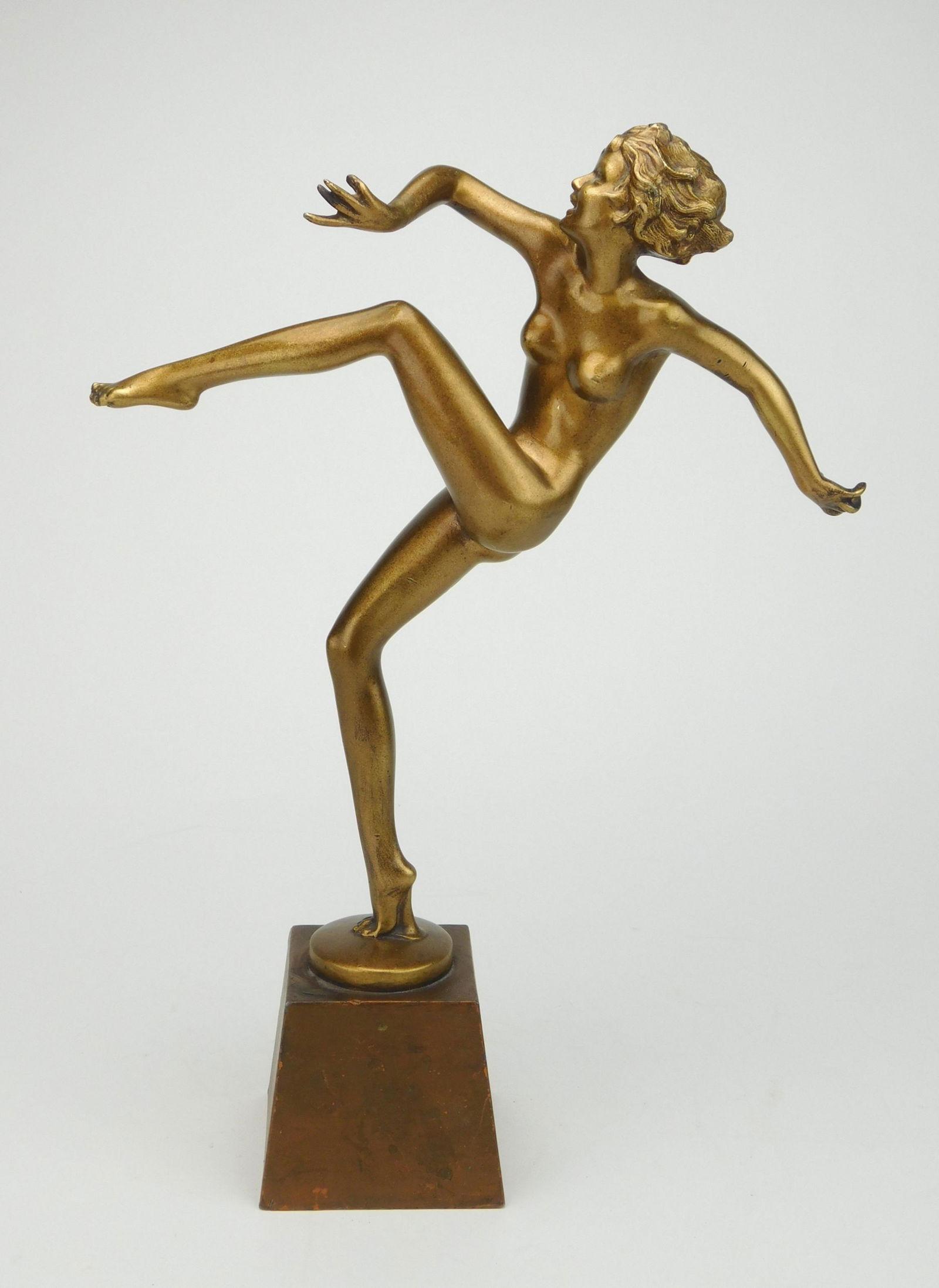 Ronson 'Kicking Dancer' figurine: Aronson / Ronson Art Deco female nude ''Kicking Dancer'' figural sculpture attributed to Austrian artist Josef Lorenzl and produced by Art Metal Works (Ronson) c. 1930-40, original gold gilt patina an