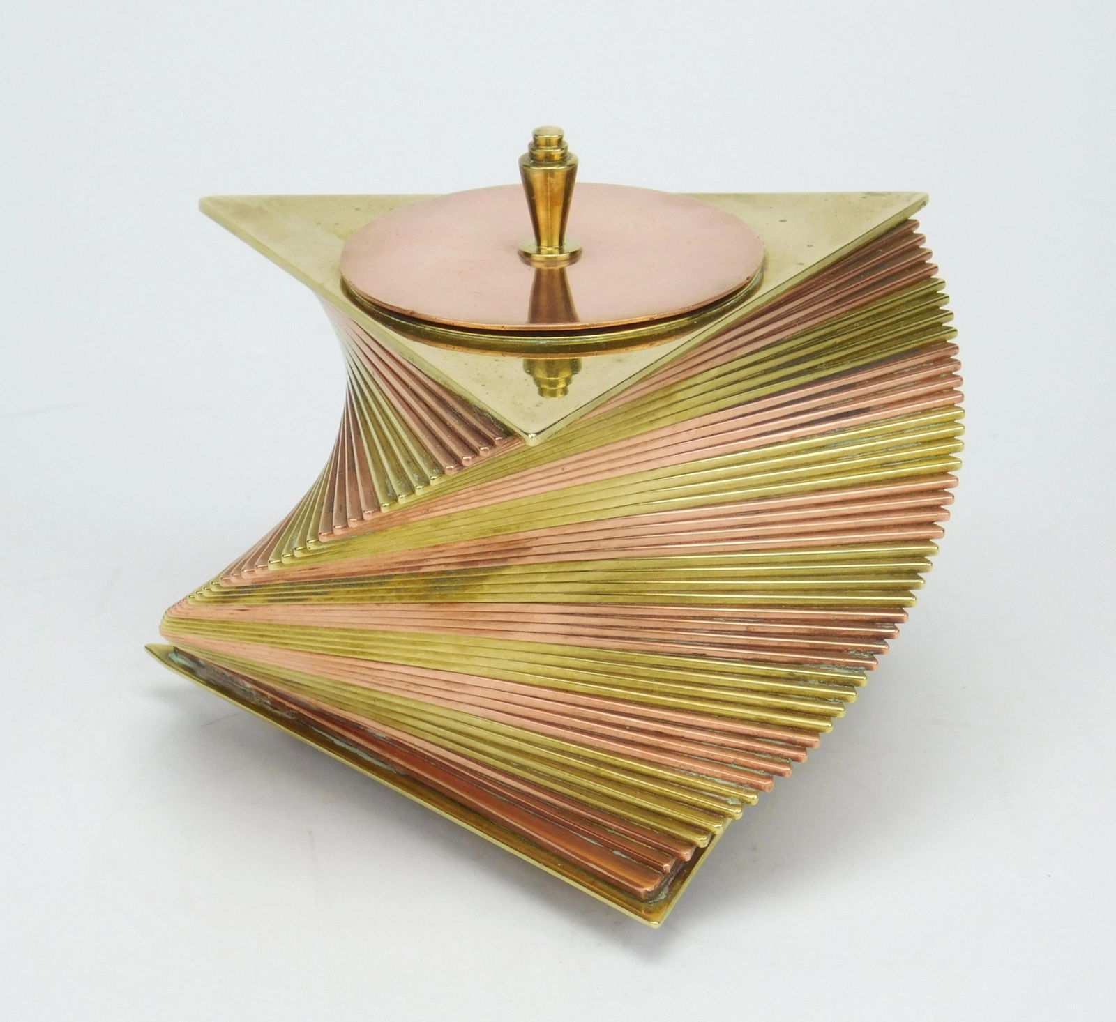 John Otar grass and copper box: John Otar Art Deco brass and copper cigarette box, ca. 1928-1935, designed, patented and produced by John Otar . The box is composed of individual triangular brass and copper plates, stacked to create