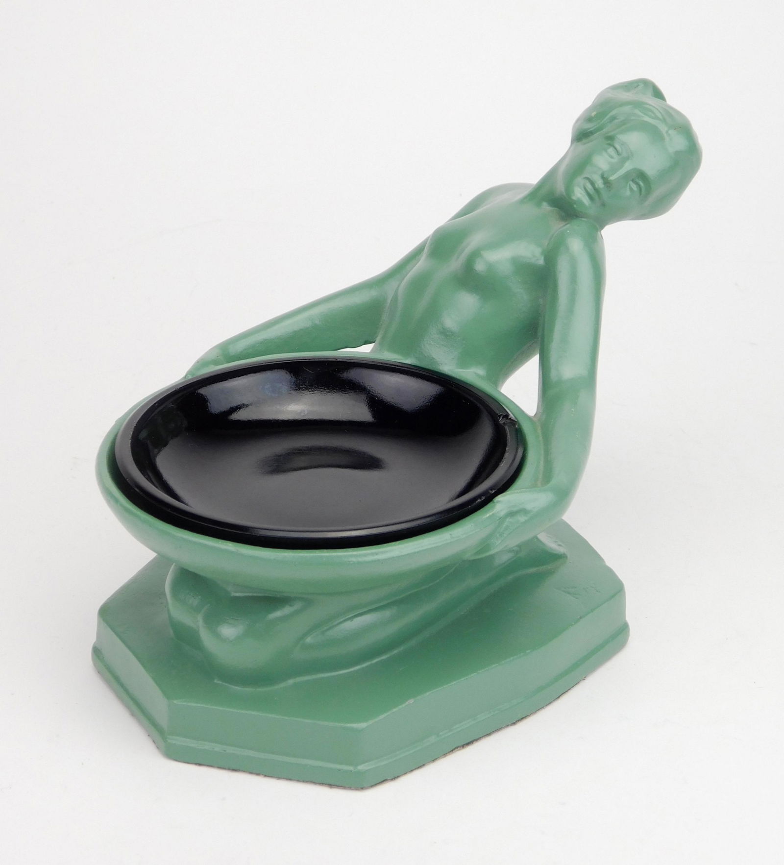 Nuart Art Deco table ashtray: Nuart Art Deco 'Offering Girl' ashtray- kneeling girl holding a tray with black amethyst glass inset, marked on center of the tray, refinished in Frankart Green. 5 1/4 x 4 1/2 x 7''