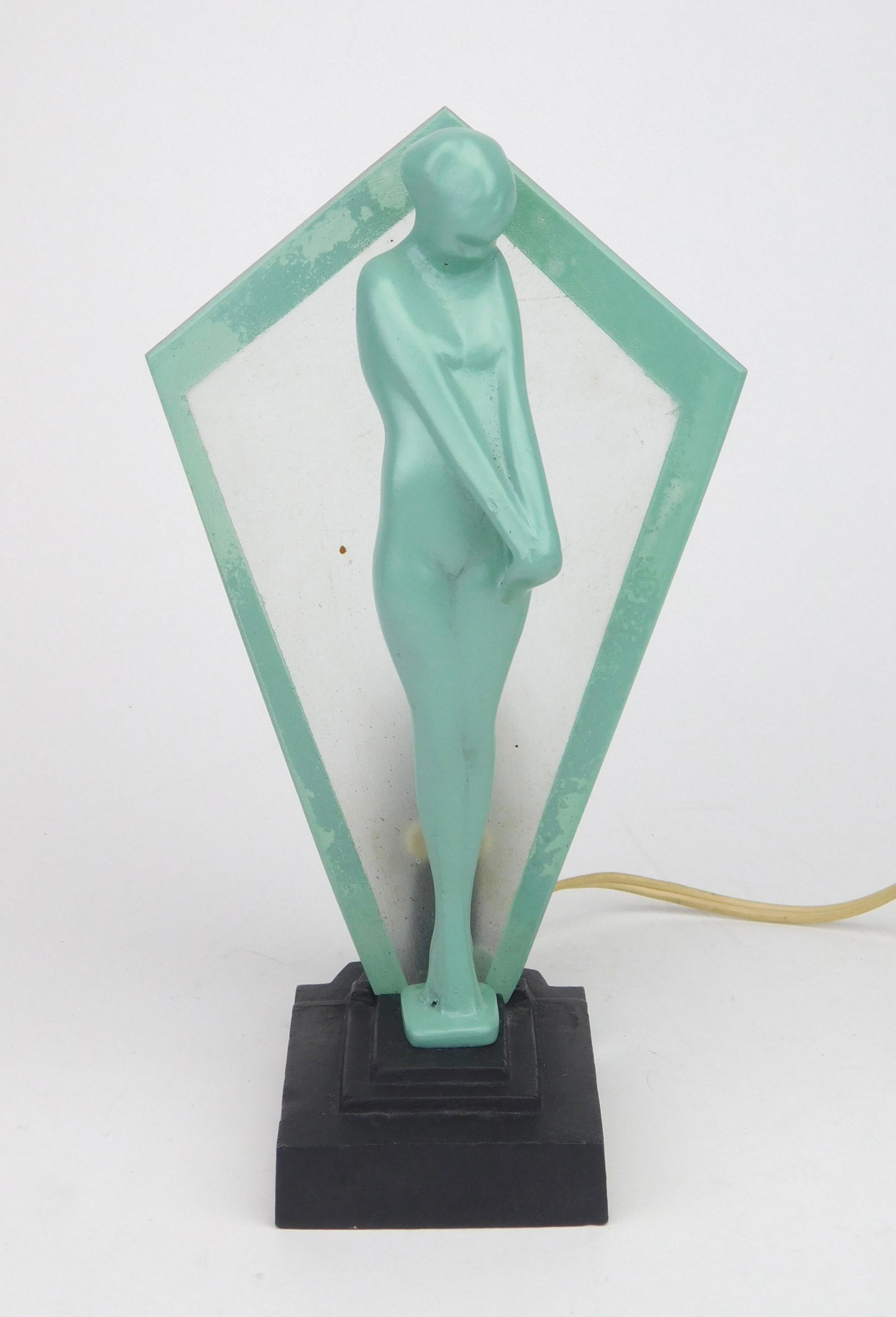 Frankart fan lamp: Frankart fan lamp, Model #L225 (variation), coy nude stand in front of fan shaped etched glass panel, black base and greenie nude, fan shade has greenie trim edges. 7''h