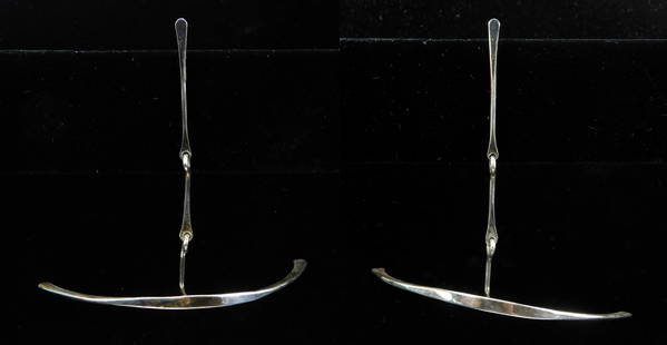 Art Smith earrings: A pair of Art Smith (American 1917-1982) earrings- ''Lady Day''- sterling silver strapped double articulating sickle scimitar kinetic design, ca. 1955-1969. 3 1/2 x 3 1/2 x 1 1/2'' This lot