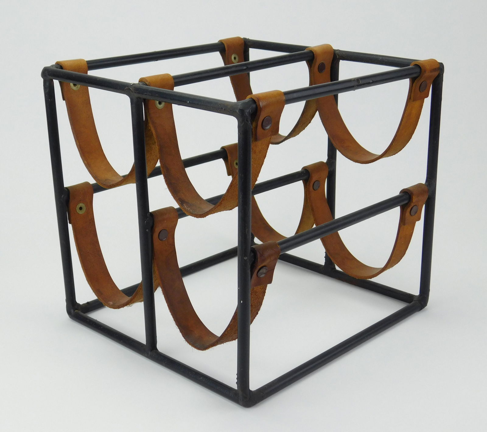 Arthur Umanoff wine rack: Arthur Umanoff (1923-1985) table top wine rack, ca. 1940-50's, enameled steel with leather slings and African Padauk top, manufactured by Raymor, original condition. 9 x 9 1/2 x 10''