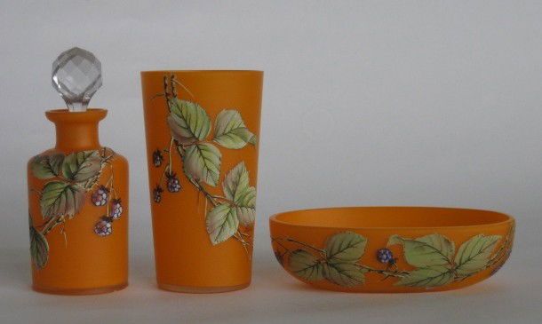 Czechoslovakian glass 3-piece boudoir set: Czechoslovakian glass 3-piece boudoir set- cup, perfume bottle and soap dish- orange with hand-painted leaf and berry decoration, cup artist signed, few chips on bottom of bottle, otherwise good condi
