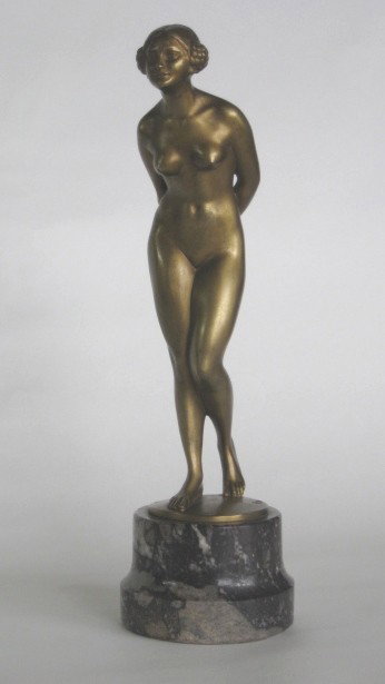 Eugene Wagner bronze sculpture: Eugene Wagner- Standing Female Nude- bronze sculpture, signed at base, set on marble base. 10 1/4''h
