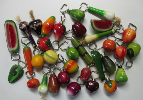 20th c. Mexican 30+ bottle openers: 20th c. Mexican 30+ hand painted and carved bottle openers- in form of vegetables and fruit- wear throughout, various sizes.