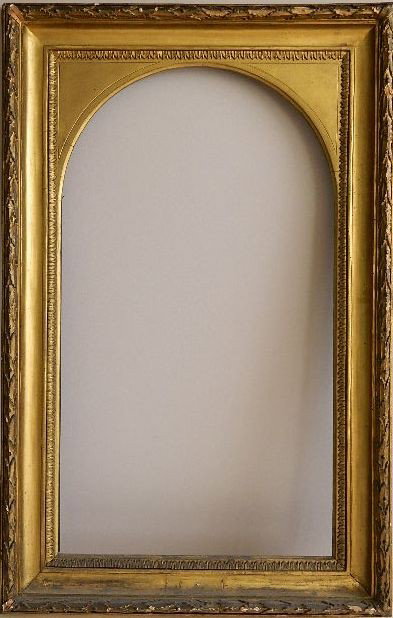 Hand carved gilded frame: Hand carved gilded frame with arched window and foliage motif, some losses to gilding. int 37 1/2 x 20 7/8'' ext 47 1/4 x 30 1/2 x 3 1/8''