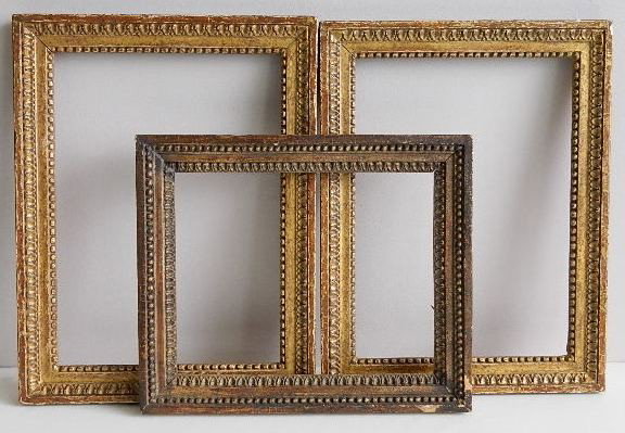 3 Hand carved egg-and-dart motif frames: 3 Hand carved egg-and-dart motif frames, gilded, each glazed, some losses to moulding, abrasions. int 10 1/4 x 8 3/8'' ext 13 7/8 x 11 1/2 x 7/8''; (2) int 9 3/8 x 13 1/4'' ea. ext 16 3/8 x 12 1/8 x 1