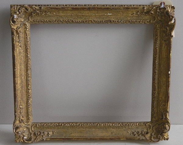 Hand carved gilded frame: Hand carved gilded frame with corner fourishes, losses to gilding. int 11 7/8 x 14 3/8'' ext 16 3/8 x 19 1/8 x 2 1/4''