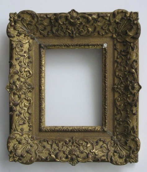 Hand carved gilded frame: Hand carved gilded frame with shell motif and c-scrolls, one loss of gilding inner moulding. int 7 x 5 3/8'' ext 12 x 10 1/2 x 1 3/4''