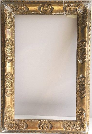 Gilded hand carved frame with floral details: Gilded hand carved frame with floral details, some minor losses at corners and upper edge, otherwise good condition. int 12 1/8 x 21 1/4'' ext 18 x 26 3/4 x 2''