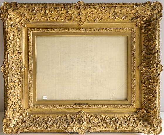 Gilded ornately hand carved high profile frame: Gilded ornately hand carved high profile frame, c scroll decoration, dirt grime, minimal losses. int 11 x 15 5/8'' ext 22 1/2 x 26 7/8 x 3 1/4''