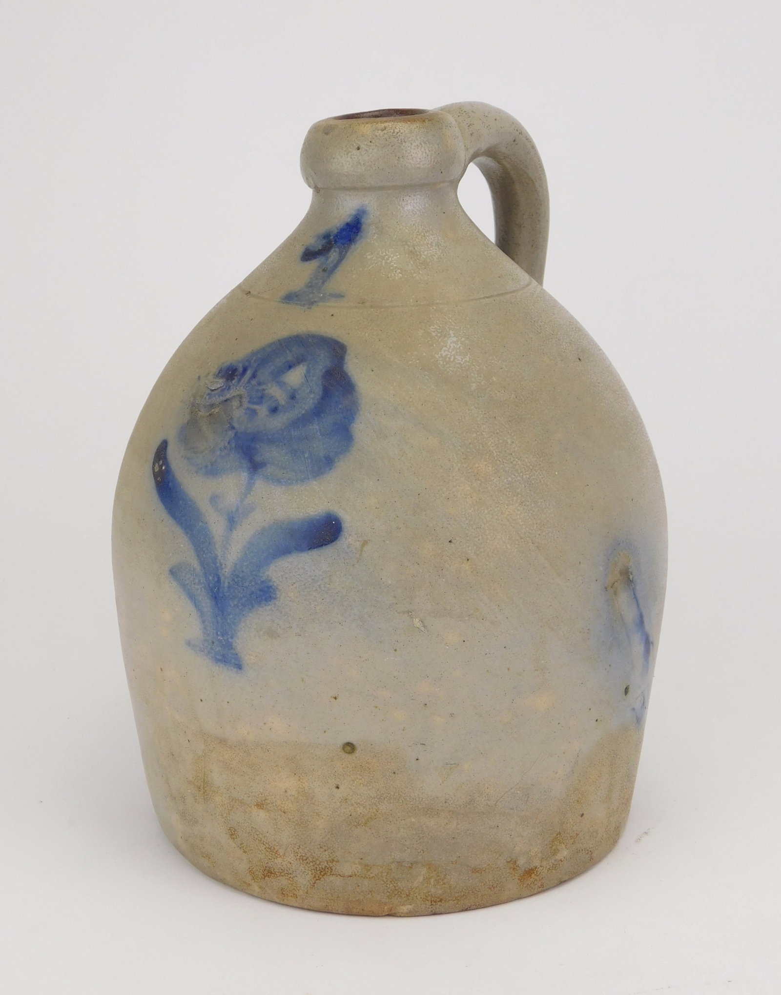 1 Gallon stoneware jug: 1 Gallon stoneware jug decorated with cobalt blue flower. 10"h