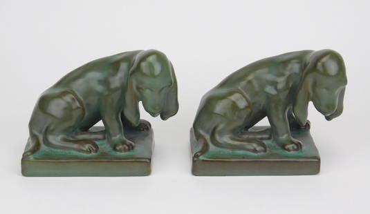 Pair of Rookwood bookends: Pair of Rookwood Dog bookends, done in brown blue mat glaze, 1940, marks include Rookwood logo, the date, shape # 2998 and the cast monogram of designer Louise Abel, 4 7/8"h