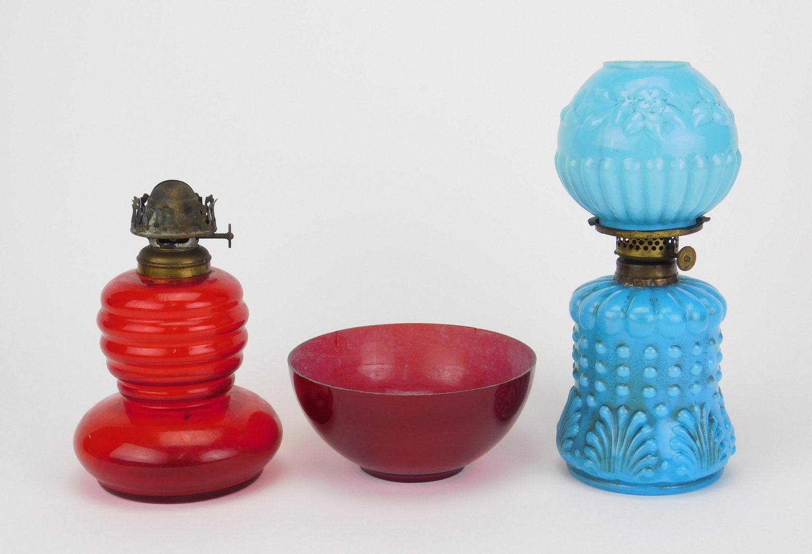 2 Miniature oil lamps: 2 Miniature oil lamps- 1 blue and 1 cranberry base with a mismatched cranberry shade 