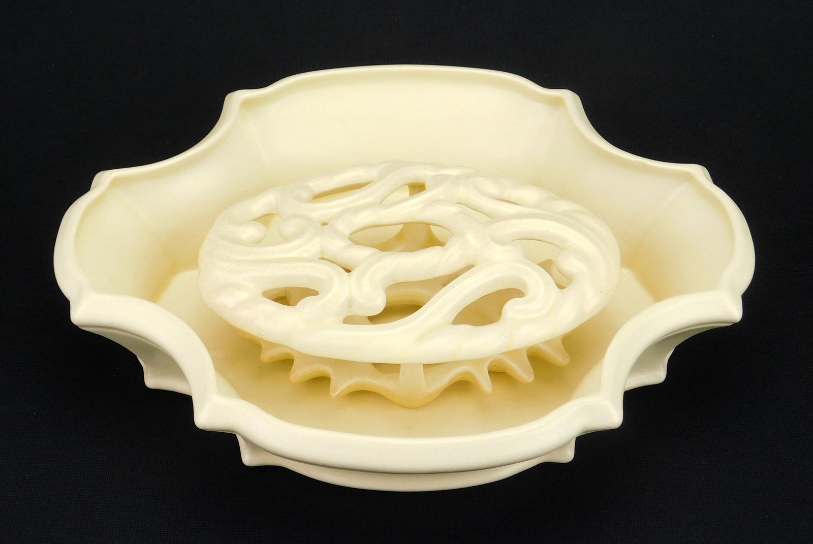 Cowan pottery Bowl and Flower Frog: Cowan pottery 'Ambassador' Bowl and Flower Frog, 1929, Special ivory glaze, both forms attributed to R. Guy Cowan, both marked. Bowl- 11 1/4 x 9 1/4" Grid- 6 3/4 x