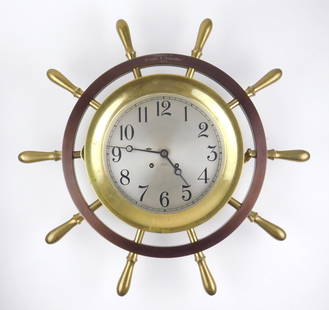 Chelsea's Ship Bell Clock: Chelsea's Ship Bell Clock- ship wheel form. 20" dia. Provenance: Bratenahl, OH estate Descended through family George M. Humphrey