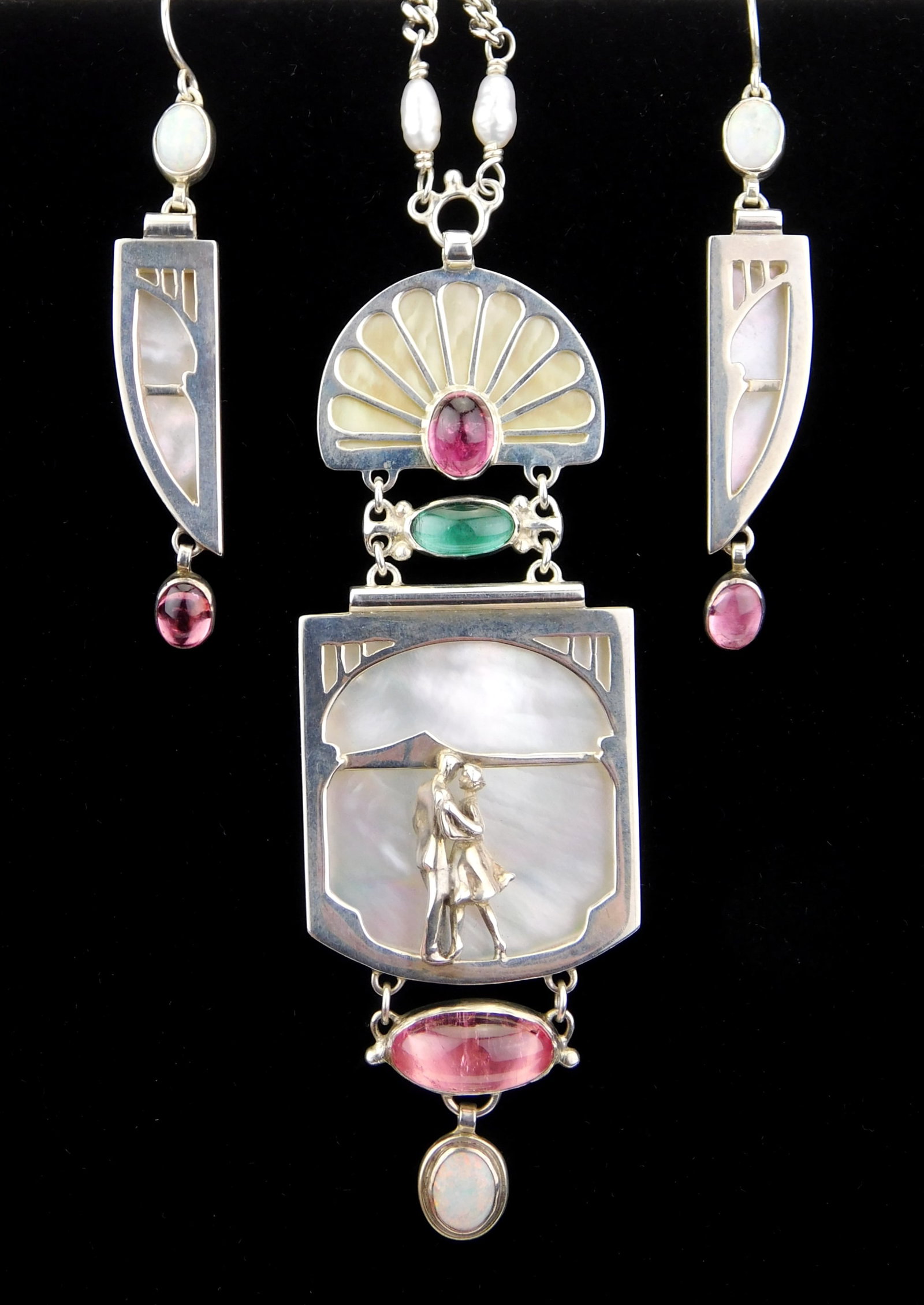 J. Campbell sterling silver and earrings: J. Campbell sterling silver and mother of pearl necklace with matching earrings, pendant ornamented with a dancing couple, marked. Provenance: Private collection- Shaker Heights, OH