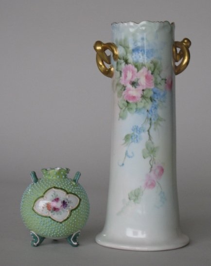 Austrian and Nippon vases: Austrian vase together with Nippon 3-footed vase, both hand painted with floral decoration, 1 stamped 'Vienna, Austria', good condition. 9 7/8'', 3 1/2''