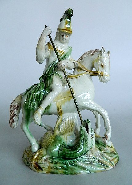 2 John Voyez Staffordshire figurine: John Voyez Staffordshire pottery figurines- 'St. George and the Dragon' & Shepherd and Dog- , several areas of repair and restoration. 10 1/2; 9''h