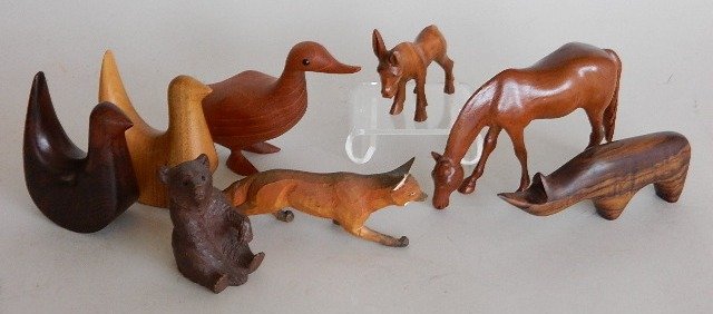 8 European and American carved wooden animals: 8 European and American carved wooden animals- including 2 German birds; Danish goose and rhino; Swiss bear and red fox; and American donkey and horse.