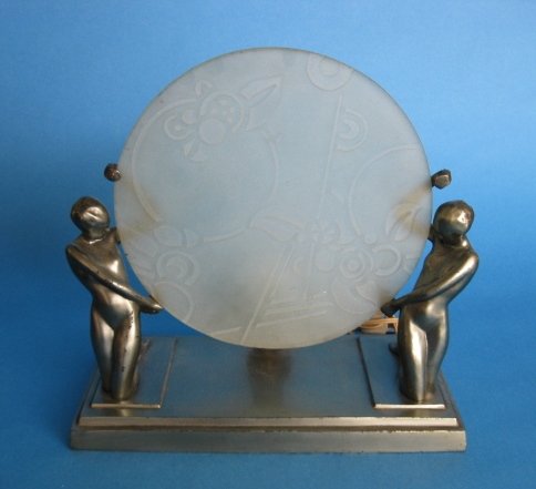 Frankart Silhouette Lamp L243: Frankart Silhouette Lamp L243- Two Nudes support a frosted glass disc, gun metal finish, marked. 13 x 12 x 6 1/4''