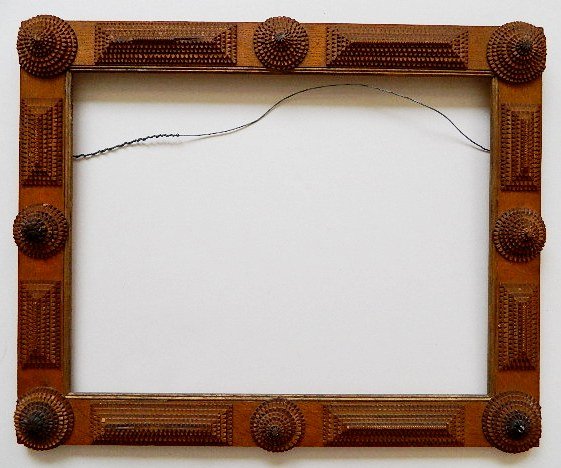 Tramp Art frame: Tramp Art frame- circles and rectangles, chip carved and stacked, several nicks and scratches. int 18 x 23'' ext 22 x 27''