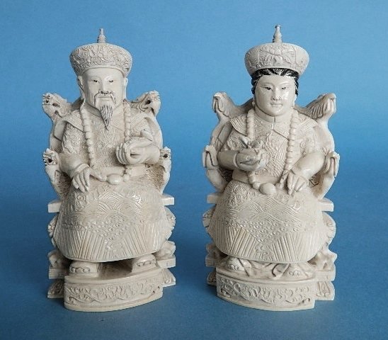 Pair of 19th/20th c. Japanese carved ivory: Pair of 19th/20th c. Japanese carved ivory- Man and Woman- eyes, hair and top of hats painted in black, Chinese characters carved and painted in black on bottom, Male figure with a few small cracks on