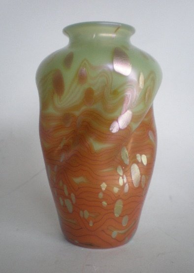 Loetz oil spot art glass vase: Loetz oil spot art glass vase, twisted pinched form in custard and burnt orange glass, unmarked. 7''h
