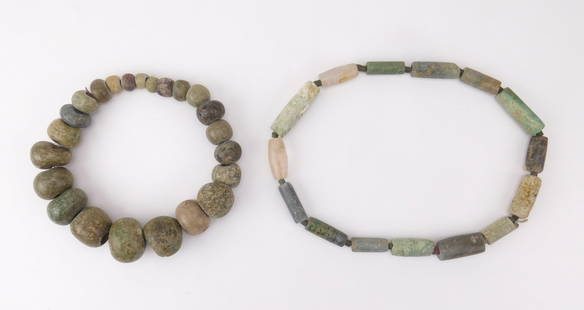 2 Pre-Columbian jade-ite stone necklaces: 2 Pre-Columbian jade-ite stone necklace, Costa Rica- 1 graduated beads, 15&#39;&#39;l; and 1 cylinder beads, 22&#39;&#39;l. Provenance: Private collection- Cleveland Heights, OH