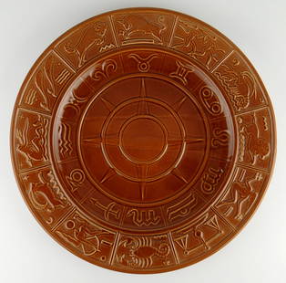 Don Schreckengost (1910-2001) zodiac charger: ceramic,&nbsp;done for the Gem Clay Forming Company of Sebring, Ohio, in burnt sienna with the symbols and signs in calendar form about the circumference.&nbsp; &nbsp;14&quot; h Provenance: Private co