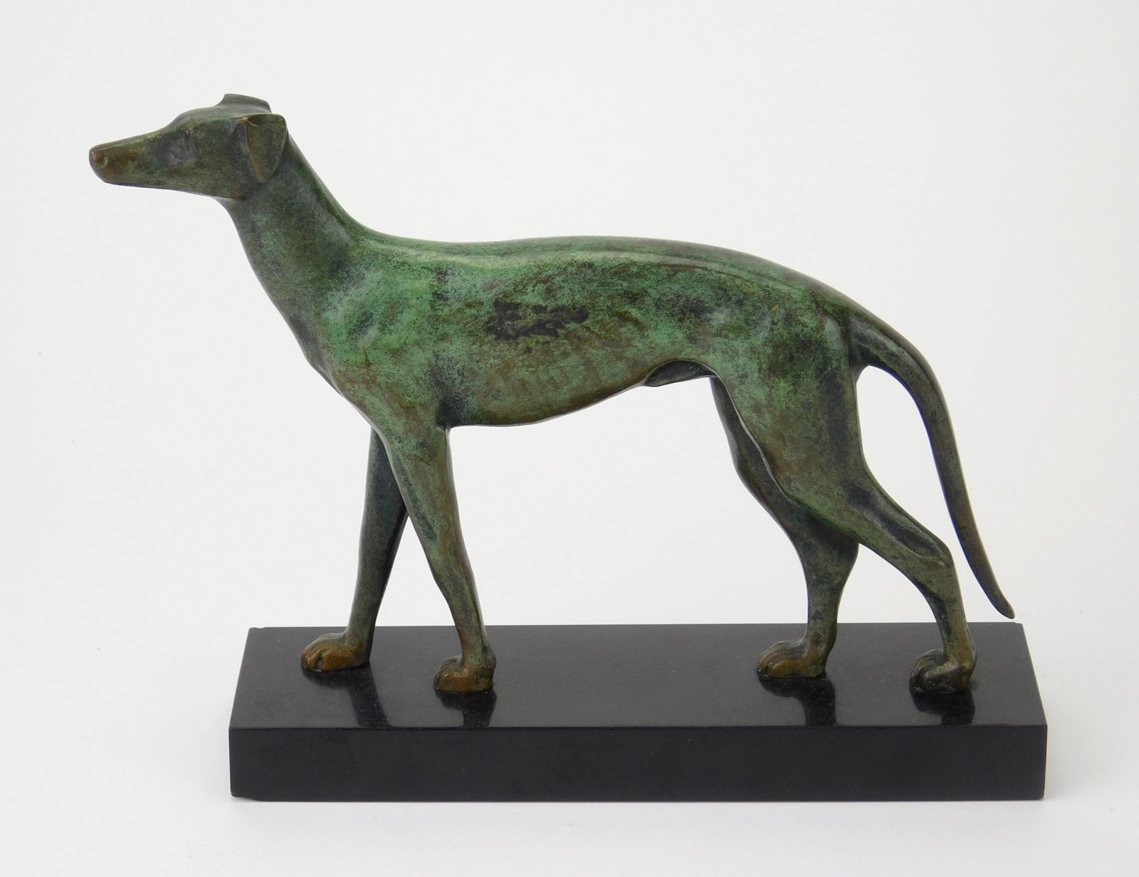 Art Deco style bronze sculpture of a Greyhound: 5 3/4 x 7 1/2 x 2" Provenance: Private collection- Elyria, OH