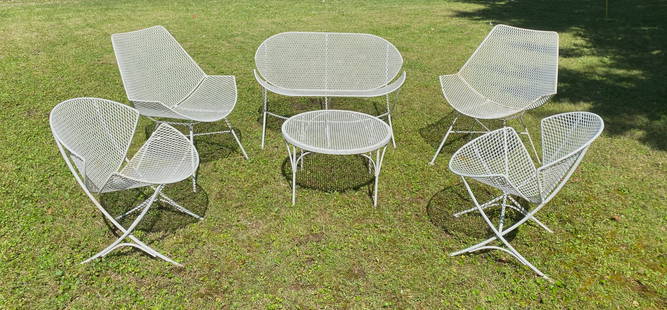 6 pc .Maurizio Tempestini for Salterini Orange Slice Iron Patio Set: including love seat, 2 pairs of chairs and table. Condition: Wear from age and being exposed to the elements, rust in many places, selling as is. Provenance: Private collection- Cleveland, OH Miller &