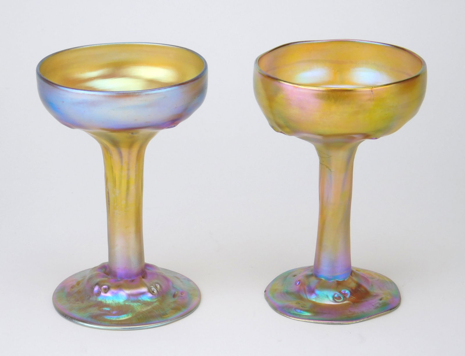 Pair of Tiffany iridescent gold glass goblets. (1 of 9)