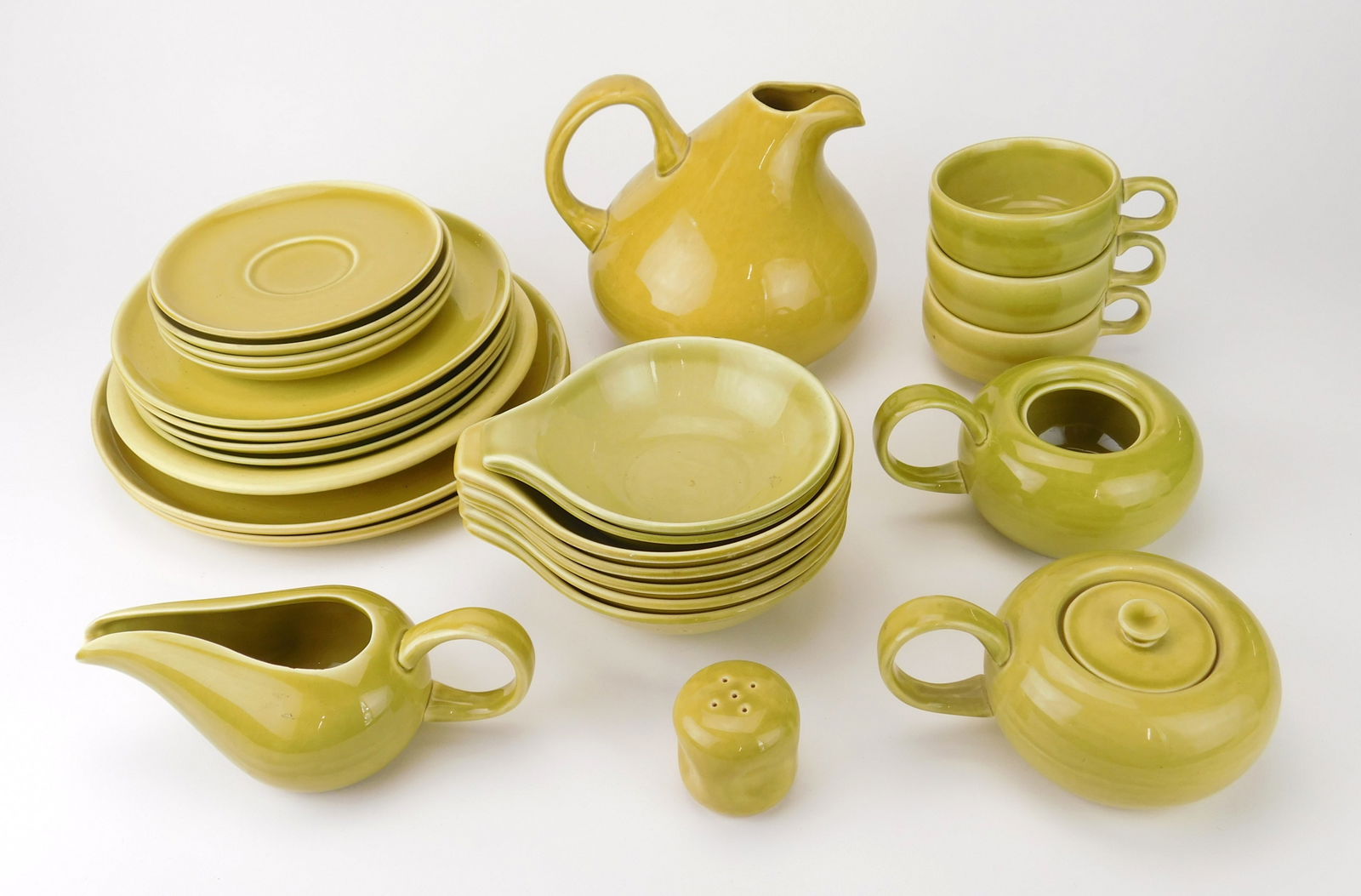 Russel Wright (American,, 1904-1976) pottery dinnerware: maufactured by Steubenville Pottery, includes 2 large plates, 5 medium plates, 3 small plates, 1 saucer, 7 soup bowls, 2 small bowls, 3 cups, 1 pitcher, 1 creamer, 2 sugar (1 missing lid) and 1 pepper