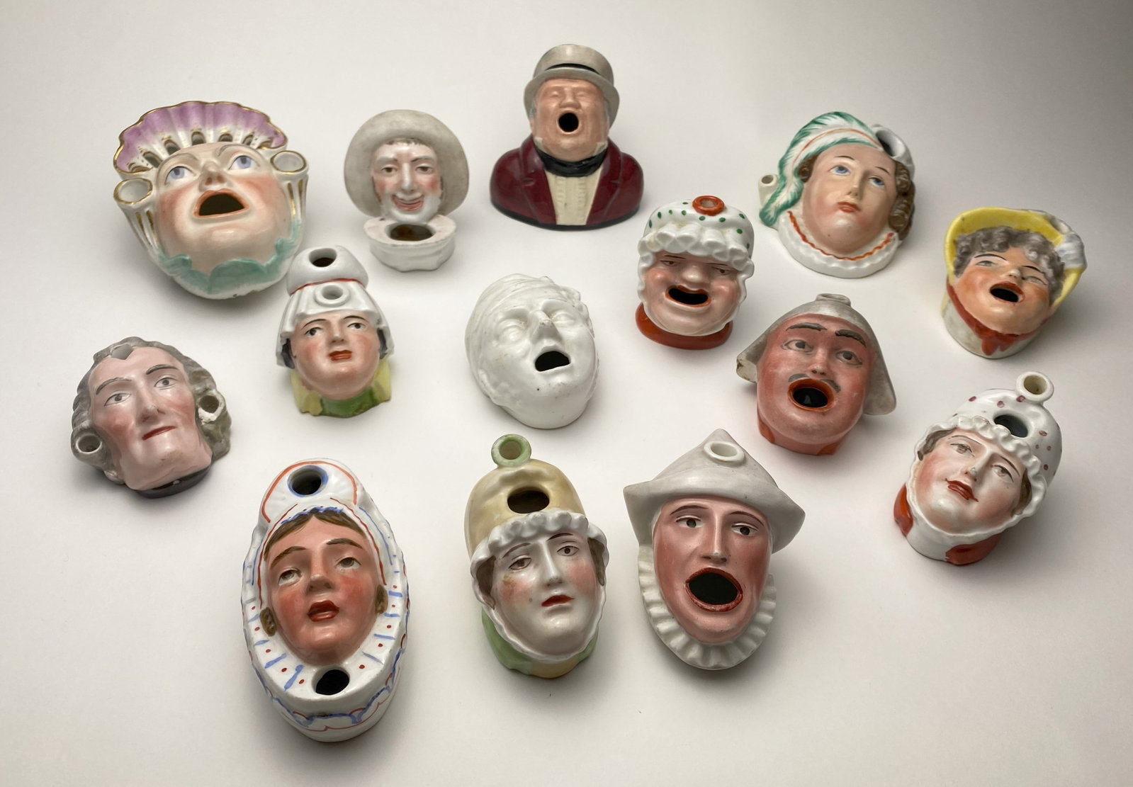 14 Figural inkpots: 1 marked- Melrose Australian Ware, rest unmarked, various sizes Provenance: Private collection- Cleveland Heights, OH