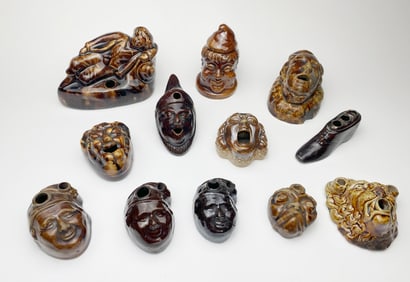 12 Brown glazed pottery figural inkwells
