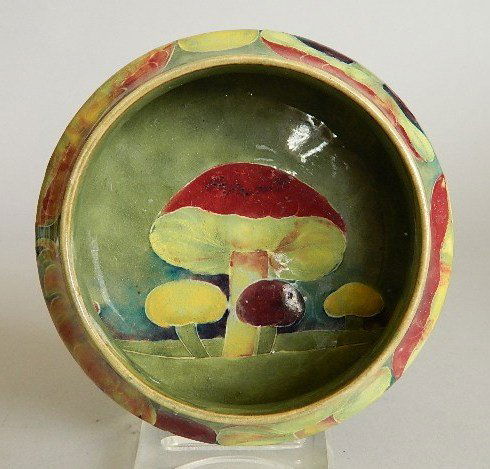 Moorcroft pottery low bowl: Moorcroft pottery low bowl- Mushroom decoration, signed and dated 1912 on bottom. 2 1/4''h, 5 3/4''dia