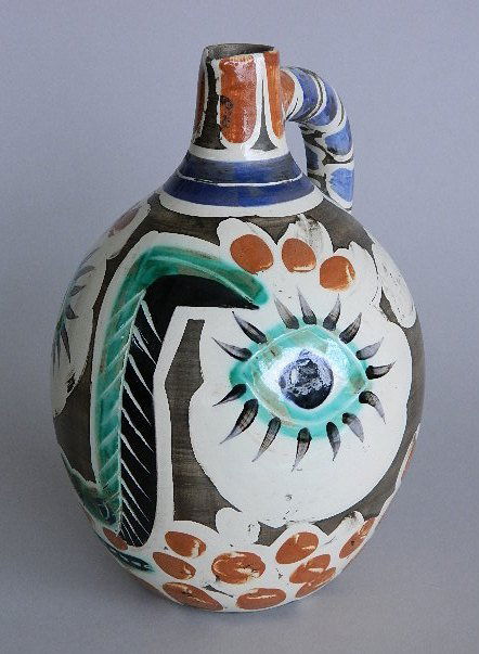 Pablo Picasso white earthenware pitcher: Pablo Picasso (Spanish 1881-1973)- ''Visage Au Nez Noir'' (Ramie )- white earthenware clay pitcher, 1969, decoration in engobes in black, green, blue white and red, engraved by knife under partial bru