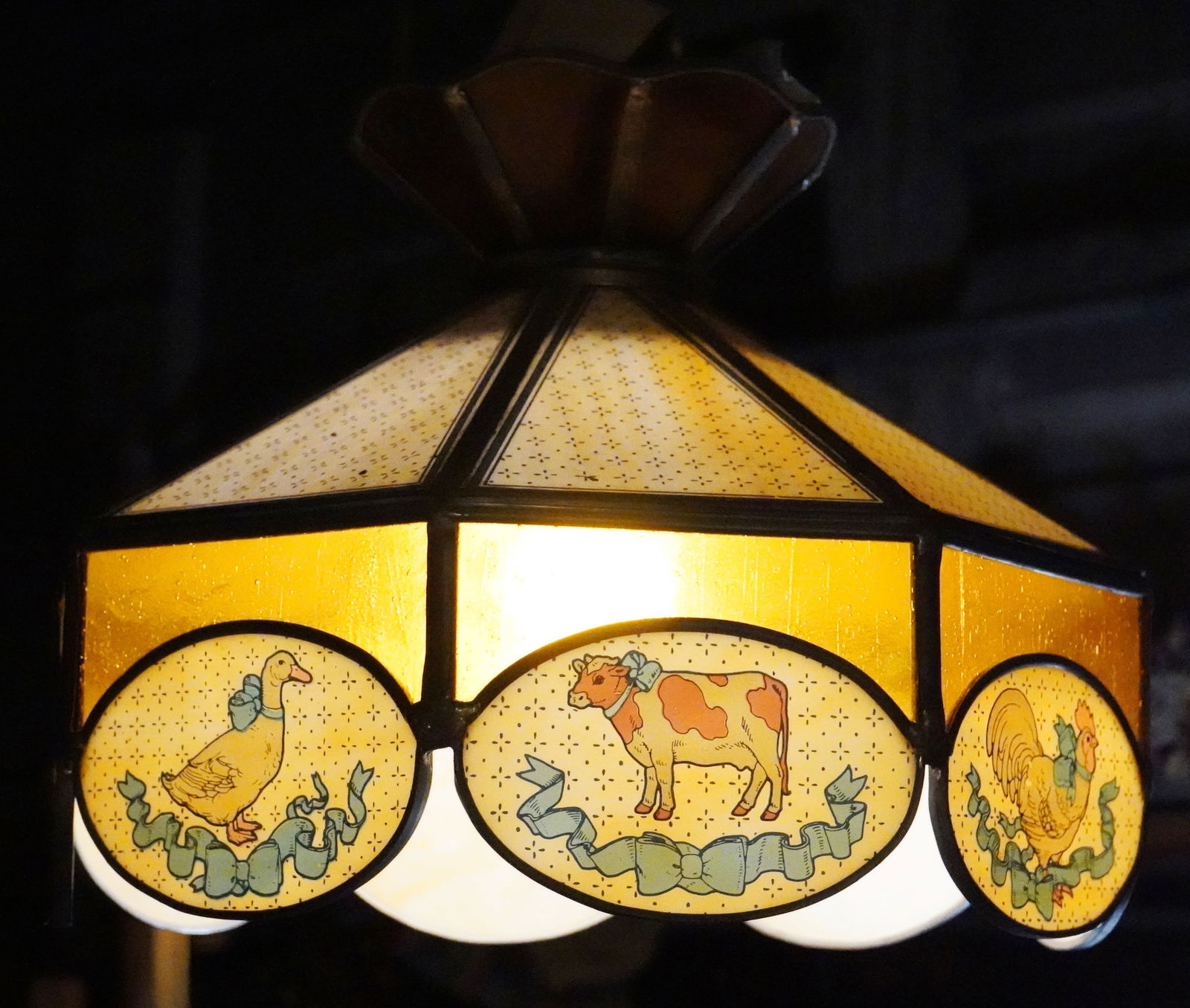 Leaded glass shade: for nursery, decorated with band of animals depicting ducks, pigs cows and roosters. 15 1/2" dia, 13":h