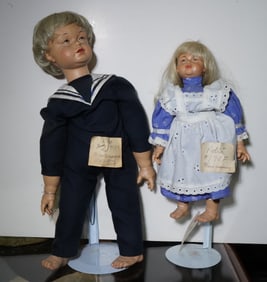 2 Hand carved wood dolls
