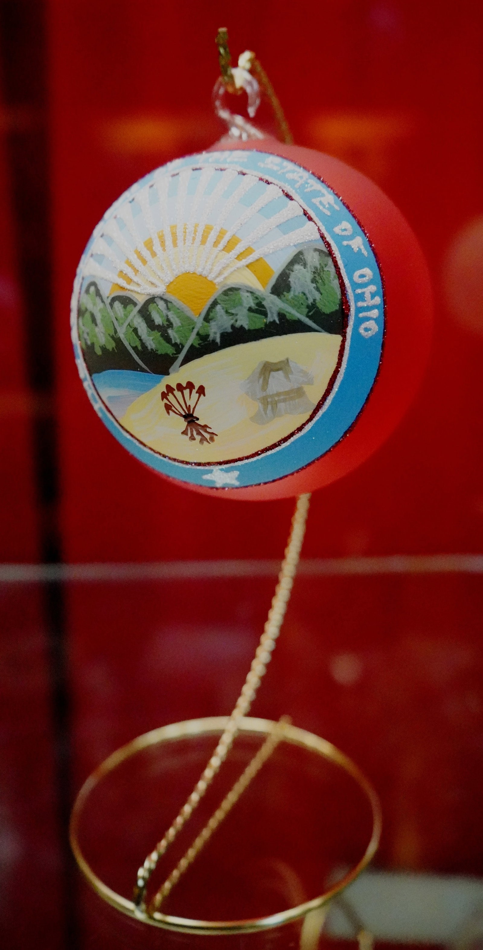 Autographed Bill Hixson designed ornament: Seal of the State of Ohio on red ground