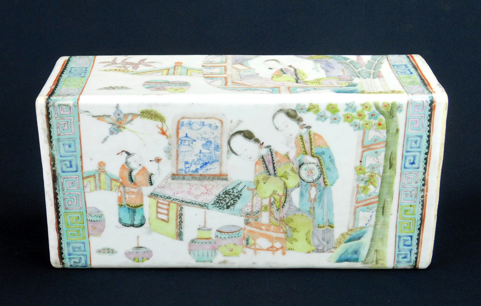 Chinese porcelain pillow: rectangular form, decorated with Ladies in Interiors. 12 x 3 7/8 x 6" Provenance: Private collection- Cleveland Heights, OH
