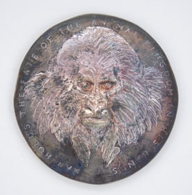 2 books by David Wynne, one with medallion