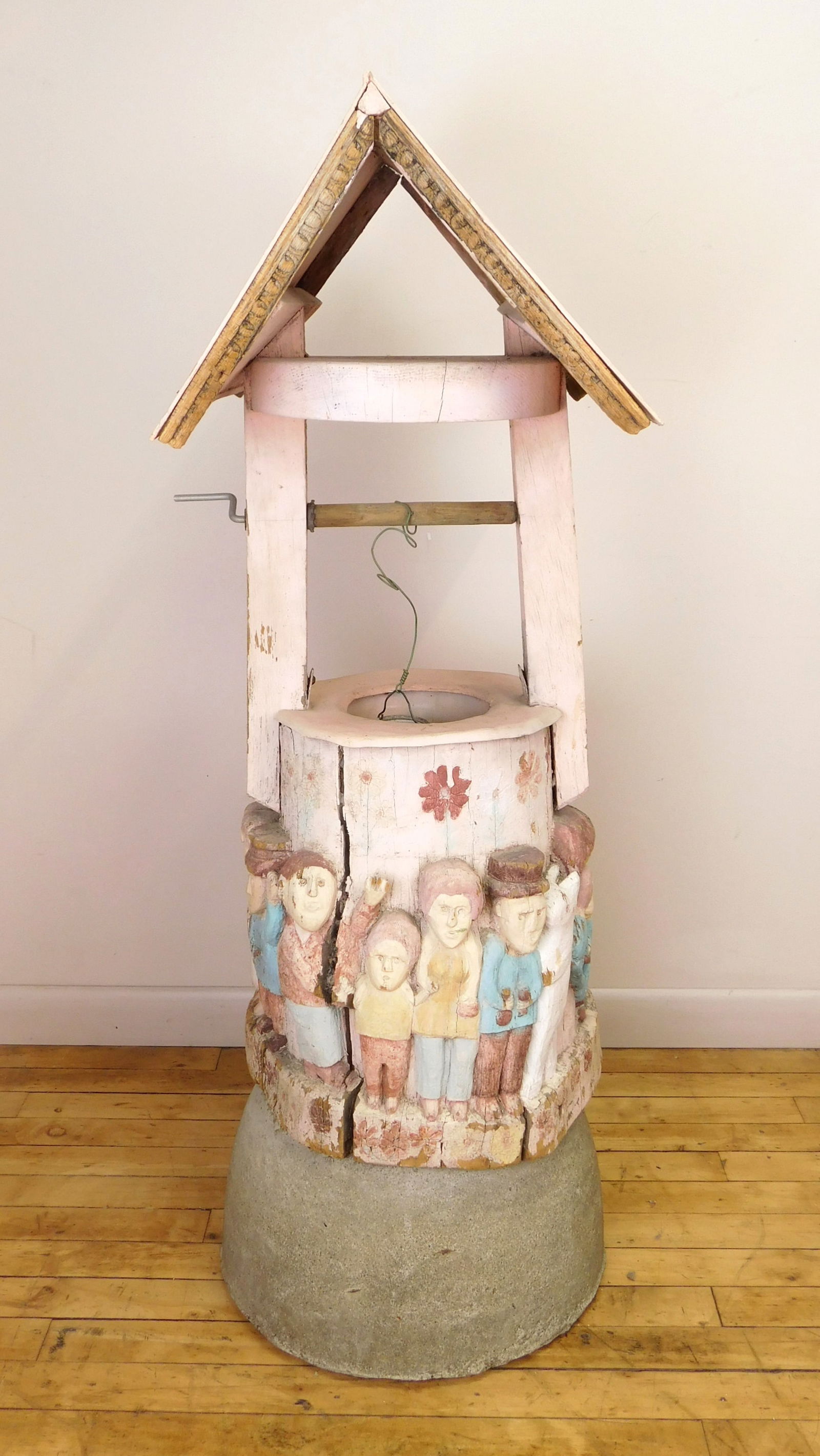Silvio P. Zoratti (Italian/ American 1896-1992) sculpture: The Wishing Well painted wood sculpture, set on concrete support, worn from being exposed to the elements. 43 1/2'' (concrete pedestal 8'') Provenance: Private collection- Ashtabula, O