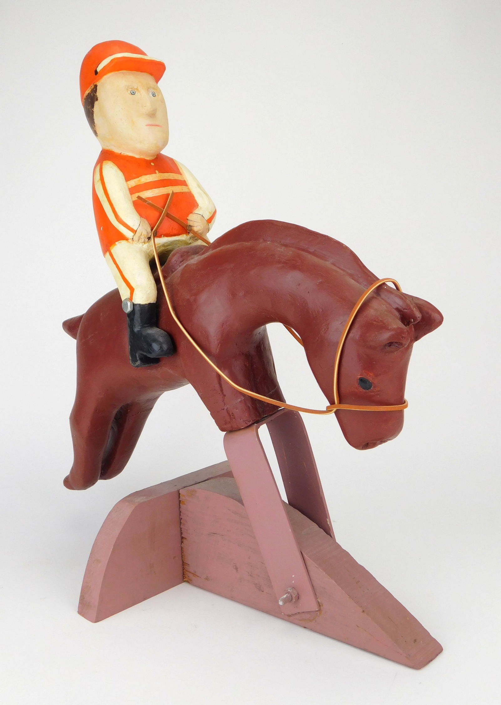 Silvio Zoratti (Italian/ American, 1896-1992) carving: Equestrian Jumper carved and polychromed wood sculpture, stamped signature S. P. Zoratti on bottom. 18 1/2 x 17 x 9 1/4" Provenance: By descent through the family Estate of the