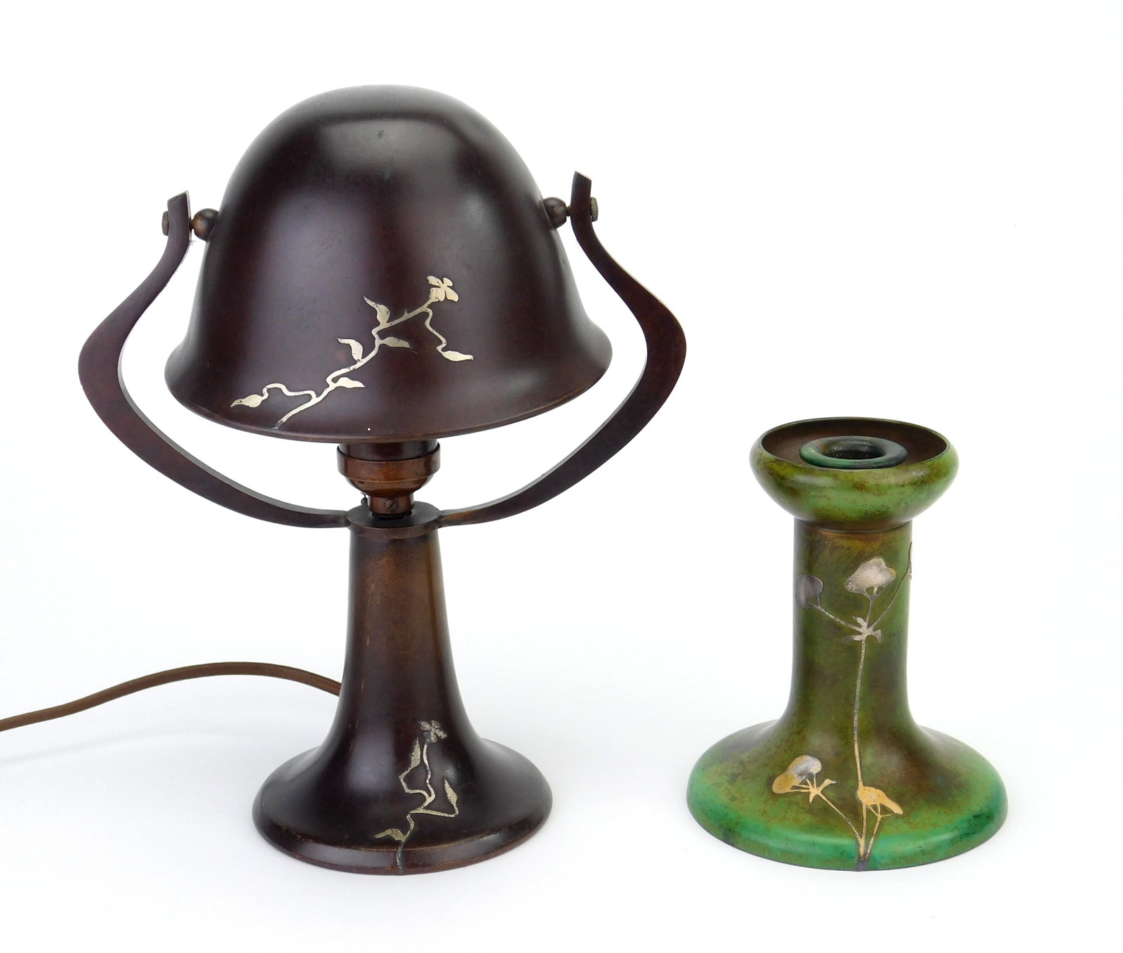 2 Arts and Crafts Heinz sterling on bronze pieces: Candlestick- 5"h Desk Lamp- 9 1/2"h Provenance: Private collection- Medina, OH *** PLEASE READ: IMPORTANT NOTE About S&H *** S&H of this auction will be handled by "Shipping with