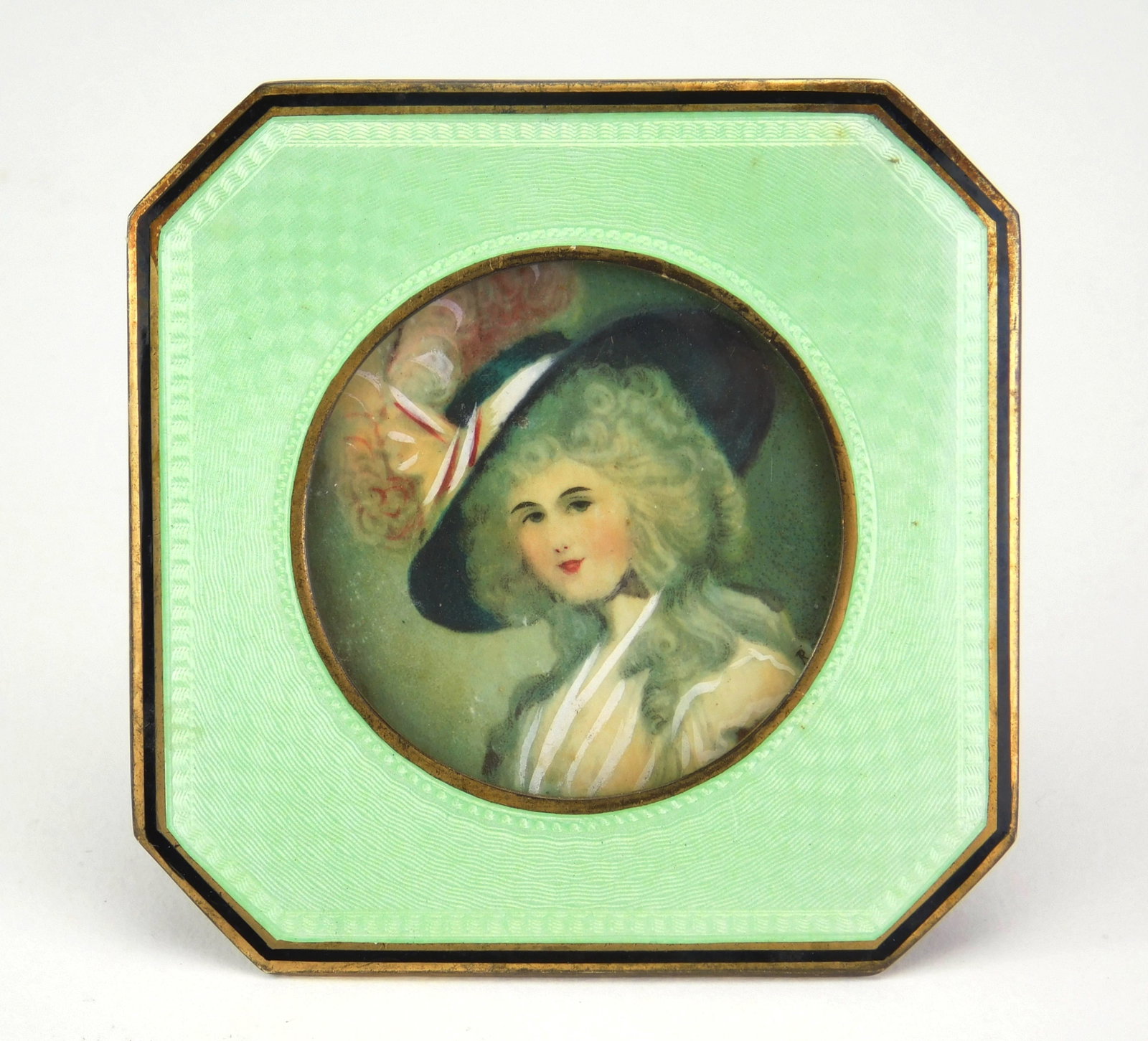 Miniature enamel frame with painting on bone: Lady in a Hat- watercolor on bone, set in light green guilloche enamel octagonal frame. 2 1/2 x 2 1/2" Provenance: Private collection- Ashtabula, OH *** PLEASE READ: IMPORTANT NOTE