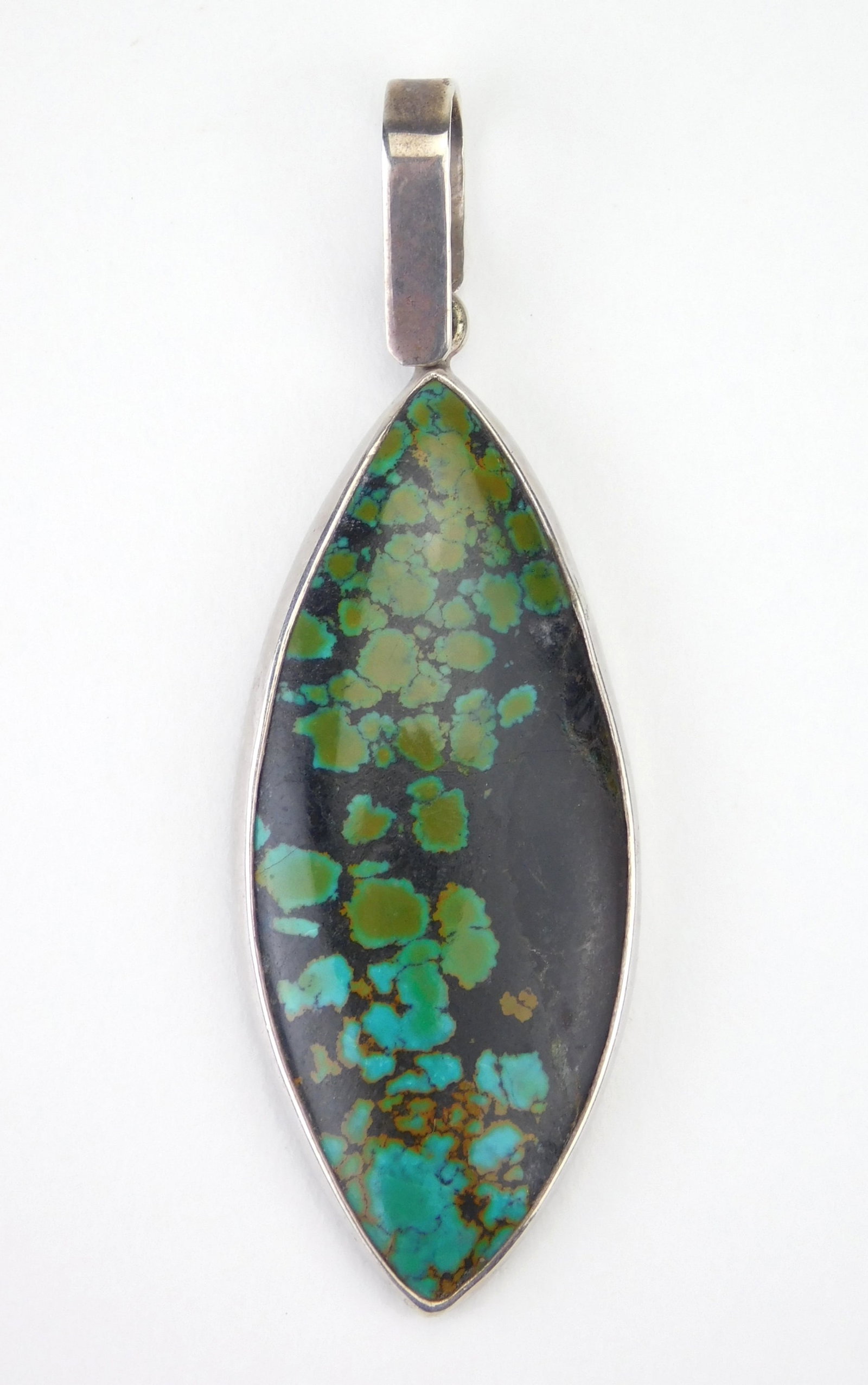 Native American turquoise and sterling silver pendant: spider web turquoise stone, marked 925/ Michael. Pendant 2 x 1" Provenance: Private collection- Ashtabula, OH *** PLEASE READ: IMPORTANT NOTE About S&H *** S&H of this auction will be handled by